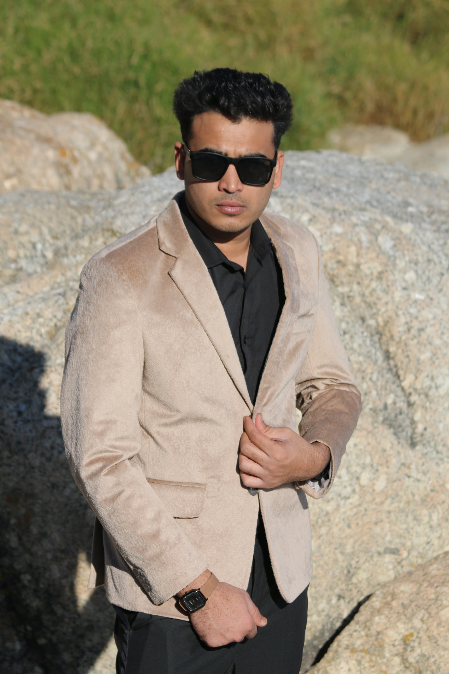 Stylish man wearing a made-to-measure camel velvet jacket by Smart Tailor in Cape Town.